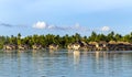Luxury overwater thatched roof bungalow resort Royalty Free Stock Photo