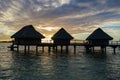 Luxury overwater villas during sunrise and Otemanu mountain at Bora Bora island, Tahiti Royalty Free Stock Photo