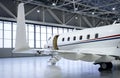 Luxury private jet plane in aviation hangar Royalty Free Stock Photo