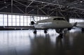 Luxury private jet plane in aviation hangar Royalty Free Stock Photo