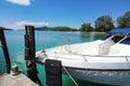 Luxury private speedboat yacht service at travel island beach pier and transparent clear sea water with cloud blue sky background Royalty Free Stock Photo