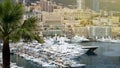 Luxury property in Monaco, many modern apartment buildings, yachts in harbor