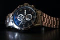 Luxury quartz chronograph watch on a black background, close-up Royalty Free Stock Photo