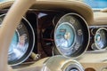 Luxury Race Retro Car Interior With Beige Finish. Speedometer And Tachometer On Dashboard. Car In Workshop