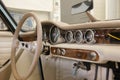 Luxury Race Retro Car Interior With Beige Finish. Speedometer And Tachometer On Dashboard. Car In Workshop Royalty Free Stock Photo