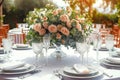 Luxury reception beautiful flowers, serving dishes, glasses on adorned table Royalty Free Stock Photo