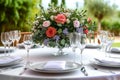 Luxury reception beautiful flowers, serving dishes, glasses on adorned table Royalty Free Stock Photo