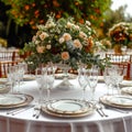 Luxury reception beautiful flowers, serving dishes, glasses on adorned table Royalty Free Stock Photo