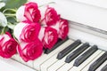 Luxury red roses on a piano. Bouquet of red roses and piano Royalty Free Stock Photo