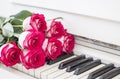 Luxury red roses on a piano. Bouquet of red roses and piano Royalty Free Stock Photo
