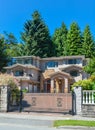 Luxury residential house with double garage, and metal gate in front Royalty Free Stock Photo