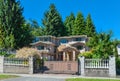 Luxury residential house with double garage, and metal gate in front Royalty Free Stock Photo