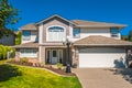 Luxury residential house with grass lawn in front