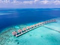 Luxury resort with overwater villas on tropical atoll island for beach holidays vacation travel and honeymoon. Luxurious hotel in Royalty Free Stock Photo
