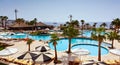 Luxury resort pool with palm trees. Royalty Free Stock Photo