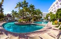 Luxury resort pool with palm trees. Royalty Free Stock Photo