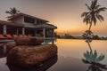 Luxury resort with swimming pool and tropical landscape palm tree at sunset Royalty Free Stock Photo