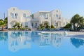 Luxury resort white villas over blue pool water Royalty Free Stock Photo