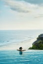 Luxury Resort. Woman Relaxing In Pool. Summer Travel Vacation Royalty Free Stock Photo