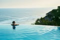 Luxury Resort. Woman Relaxing In Pool. Summer Travel Vacation Royalty Free Stock Photo