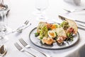 Luxury restaurant serves a modern twist on the classical ceasar salad on a dark plate Royalty Free Stock Photo