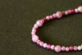 Luxury ruby necklace or bracelet on black background. Royalty Free Stock Photo