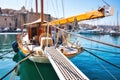 A luxury sailboat moored in a Mediterranean harbor with the gangplank extended Royalty Free Stock Photo