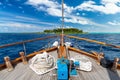 Luxury sailing boat yacht in front of tropical paradise maldives island resort with coral reef and blue ocean water tourism Royalty Free Stock Photo
