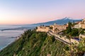 Luxury San Domenico Palace Hotel with panoramic view on snow capped Mount Etna volcano and Mediterranean sea in Taormina, Sicily