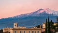 Luxury San Domenico Palace Hotel with panoramic view on snow capped Mount Etna volcano and Mediterranean sea in Taormina, Sicily Royalty Free Stock Photo