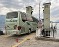 Luxury Setra bus of the fleet of the Heideker Travel and Tour Company boarding a car ferry from Menaggio.