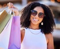 Luxury shopping and portrait of girl with gift bags and cheerful smile in sunny Los Angeles, USA. Retail, consumerism