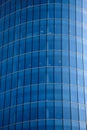 Luxury skyscraper with glass high windows. Blue toned Royalty Free Stock Photo