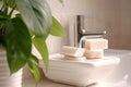 luxury soap bars on riser, plant and sink softly blurred