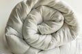 Luxury,soft,white,washable double size fiber quilt rolled on white