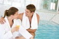 Luxury spa - happy couple relax at swimming pool Royalty Free Stock Photo