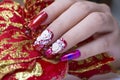 Luxury sparkling red color gel polish painting 3D rose flower decorate d with shiny rhinestone and glitter on fashionista woman