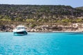 Luxury speedboat waving in blue lagoon of Mediterranean sea. Cyprus island with beautiful coastline, copyspace