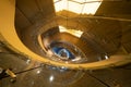 Luxury spiral staircase in lobby hotel with marble floor. Lighting architecture interior design decoration Royalty Free Stock Photo