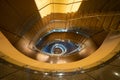 Luxury spiral staircase in lobby hotel with marble floor. Lighting architecture interior design decoration Royalty Free Stock Photo