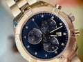Luxury stainless steel watch with chronograph, dark blue dial and metal bracelet close-up. Macrophotography of watch details Royalty Free Stock Photo