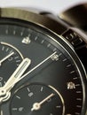 Luxury stainless steel watch with chronograph, dark blue dial and metal bracelet close-up. Macrophotography of watch details Royalty Free Stock Photo