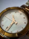 Luxury stainless steel watch with chronograph, white dial and metal bracelet close-up. Macrophotography of watch details Royalty Free Stock Photo