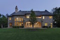 Luxury stone home at dusk Royalty Free Stock Photo