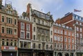 Luxury stores like Hatchards, oldest London book store in old houses on Piccadilly one of London's main shopping streets Royalty Free Stock Photo