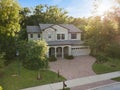 Luxury Suburban Home surrounded by trees Royalty Free Stock Photo