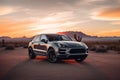 luxury suv parked in the desert at sunset with cacti and mountains in the background Royalty Free Stock Photo