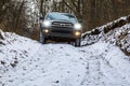 Luxury SUV 4x4 advancing in the snow. Royalty Free Stock Photo