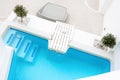 Luxury swimming pool with blue water in a hotel. Santorini island, Greece Royalty Free Stock Photo