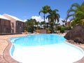 Luxury swimming pool in Guadeloupe Island. Palm trees. Antilles Royalty Free Stock Photo